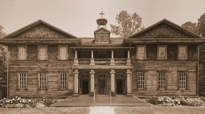 A sepia photograph of a large building with a steeple